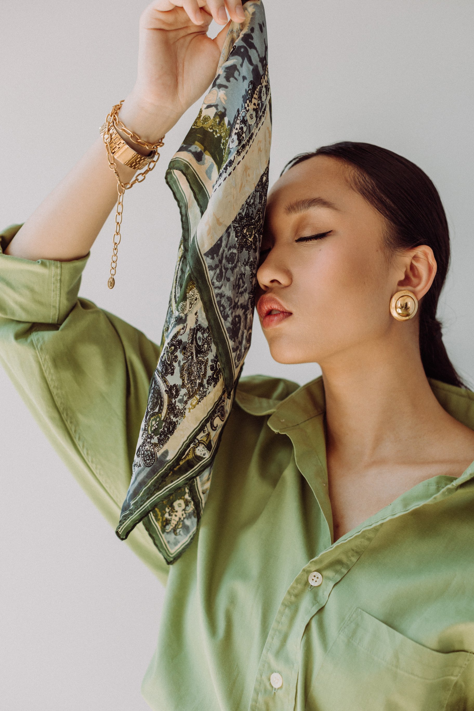 Woman Holding Green Scarf